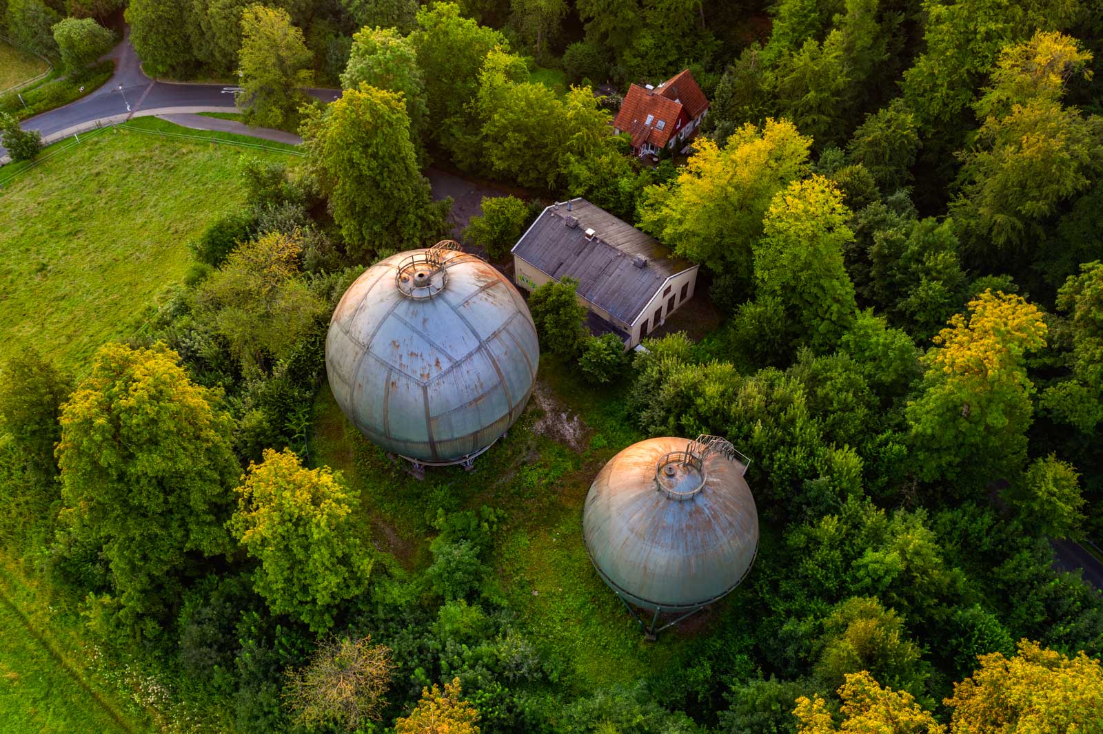 Sunrise above the old gasometers in the Teutoburg Forest (Bielefeld-Bethel, Germany).
