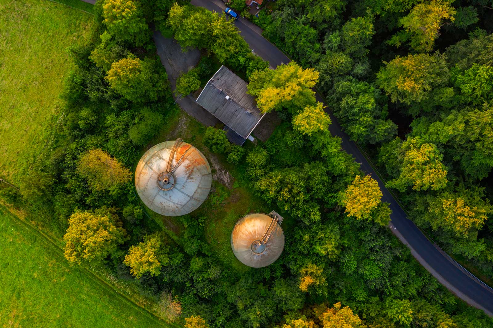 Sunrise above the old gasometers in the Teutoburg Forest (Bielefeld-Bethel, Germany).