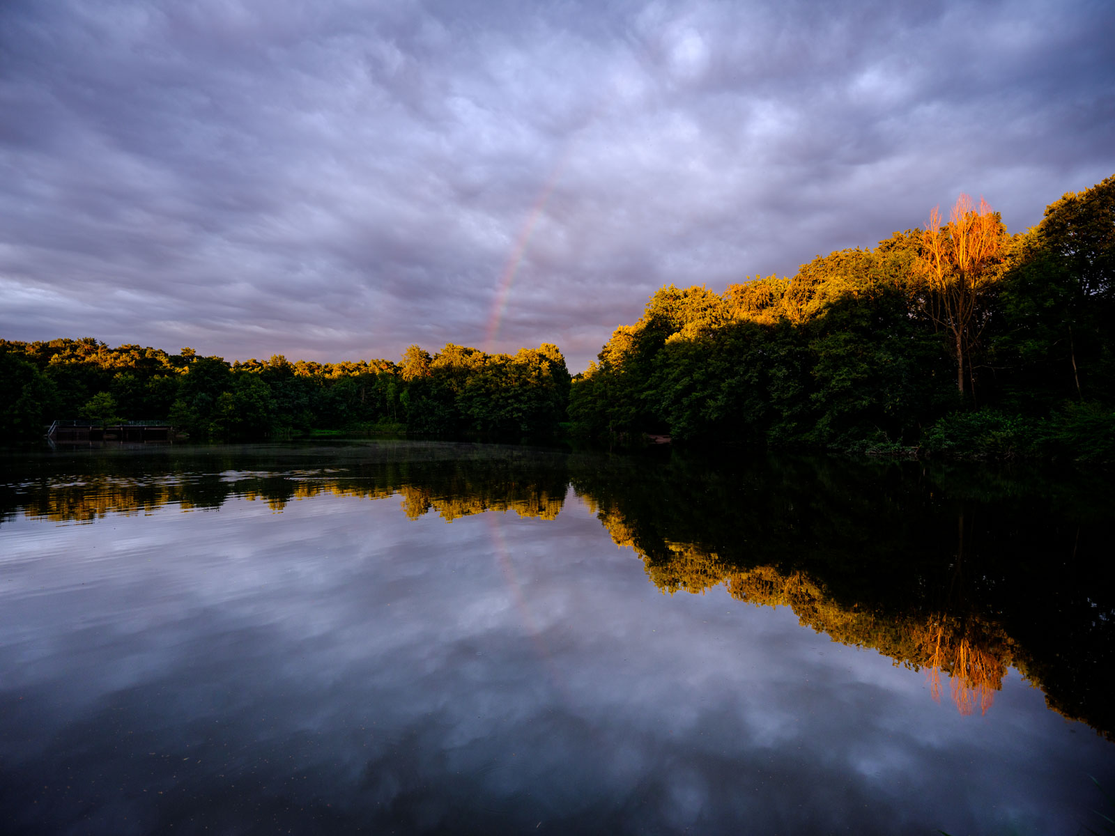 Sunset with rainbow at 'Bockschatzteich' in August 2020 (Bielefeld-Brackwede, Germany).