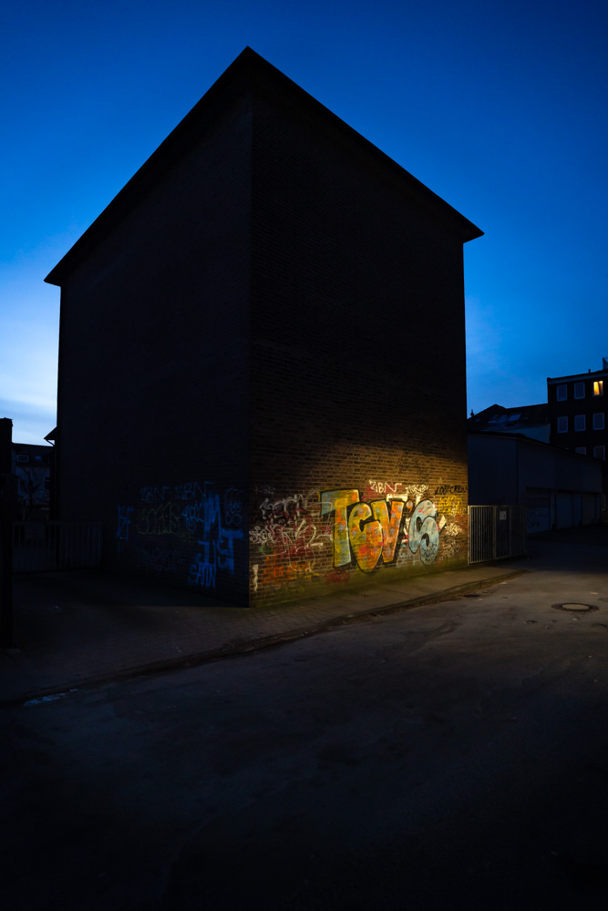 Graffiti in the light of a street lamp
