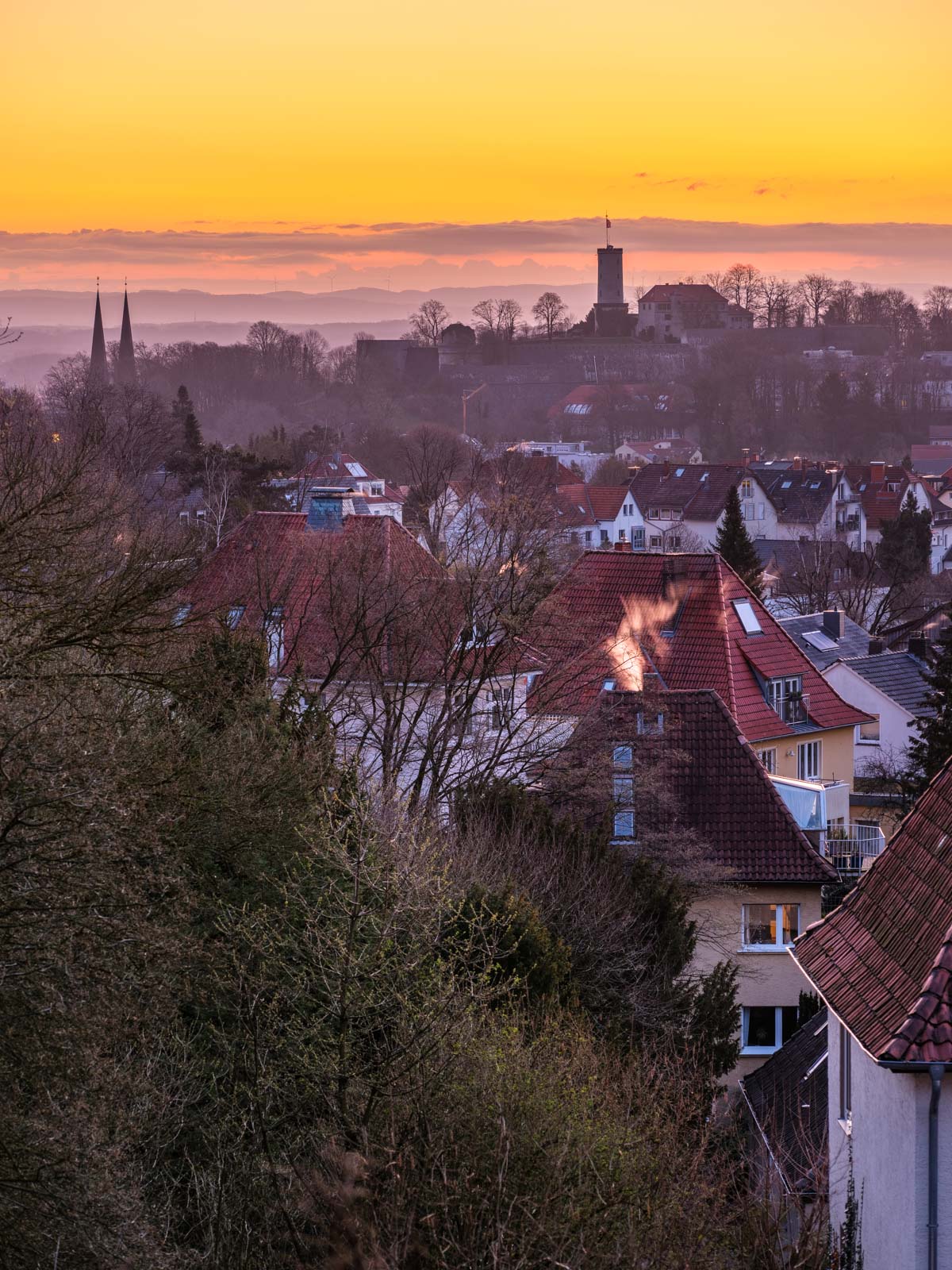 Spring sunrise over Bielefeld with Sparrenburg Castle.